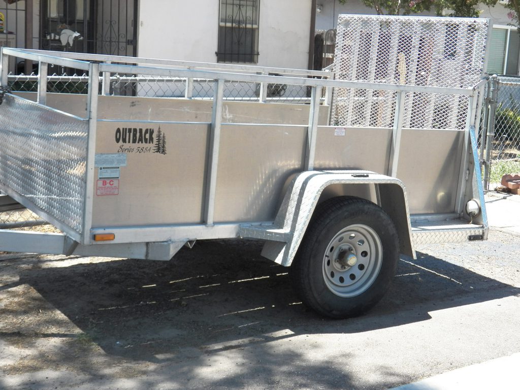 Skid steer attachments. Silver Utility Trailer